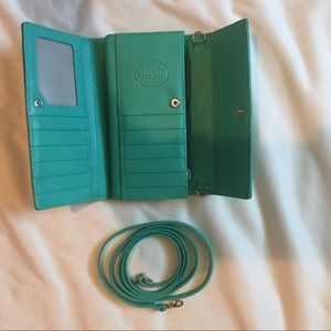Mint turquoise Roots wallet with strap